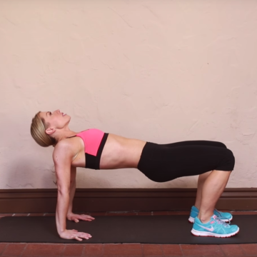 Woman doing reverse table top ab exercise